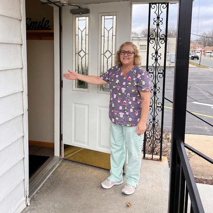 staff member showing front door