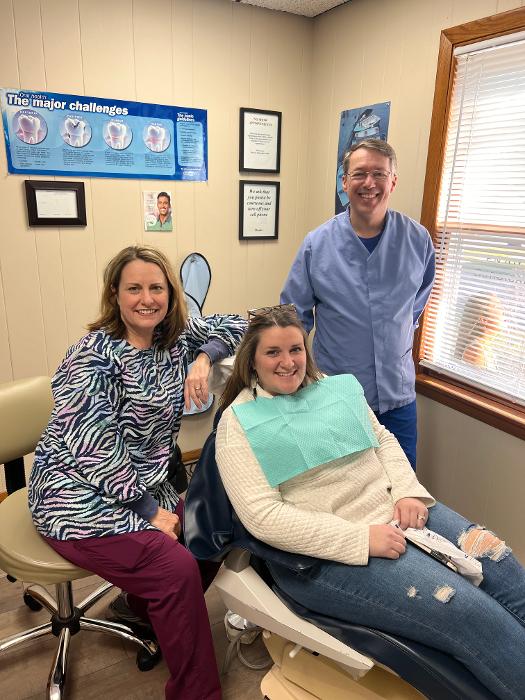 Dr. Richardson and staff with a patient in kalamazoo