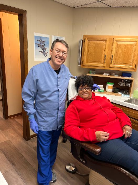 Dr mark and a patient after getting dentures