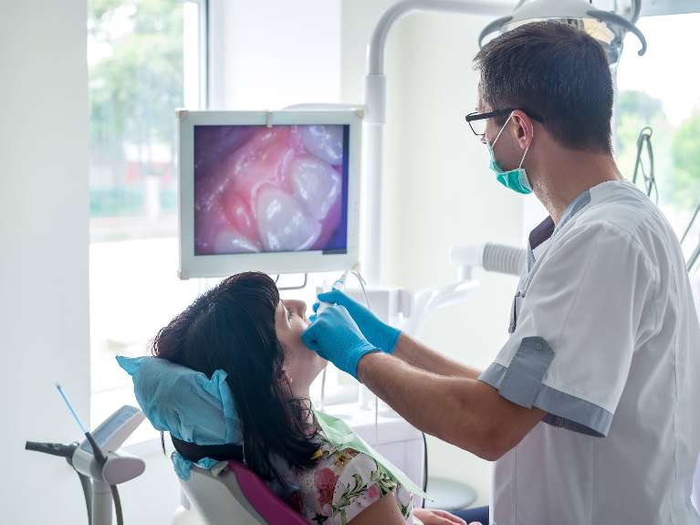 dentist using intraoral camera in kalamazoo